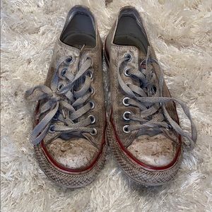 Very worn white converse low tops